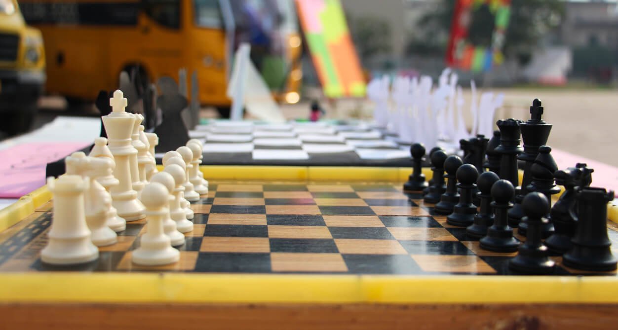 A chess board mid-game at the school chess club