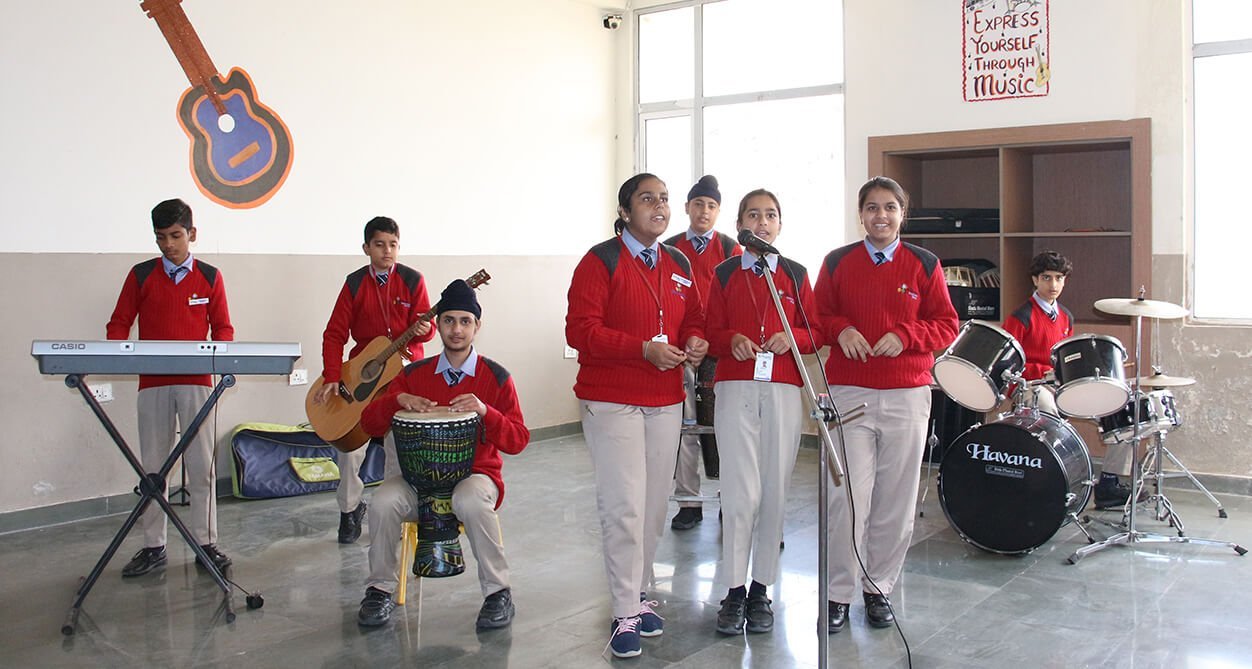 The school band rehearsing in the music room