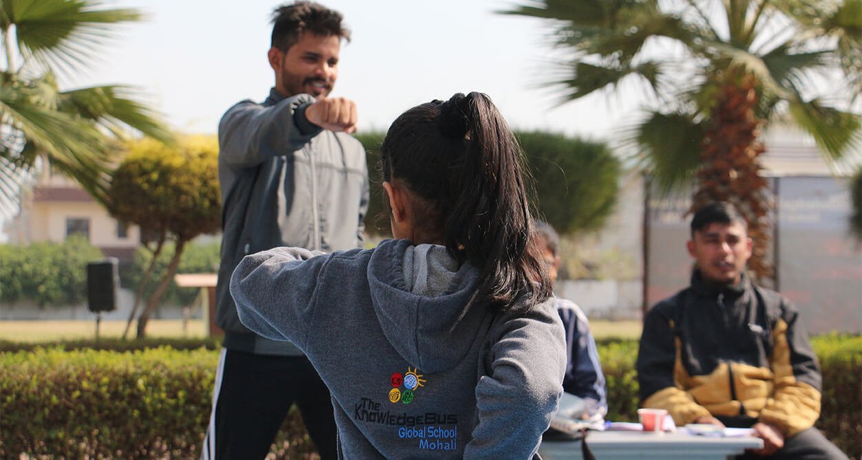A coach guiding a student through technique