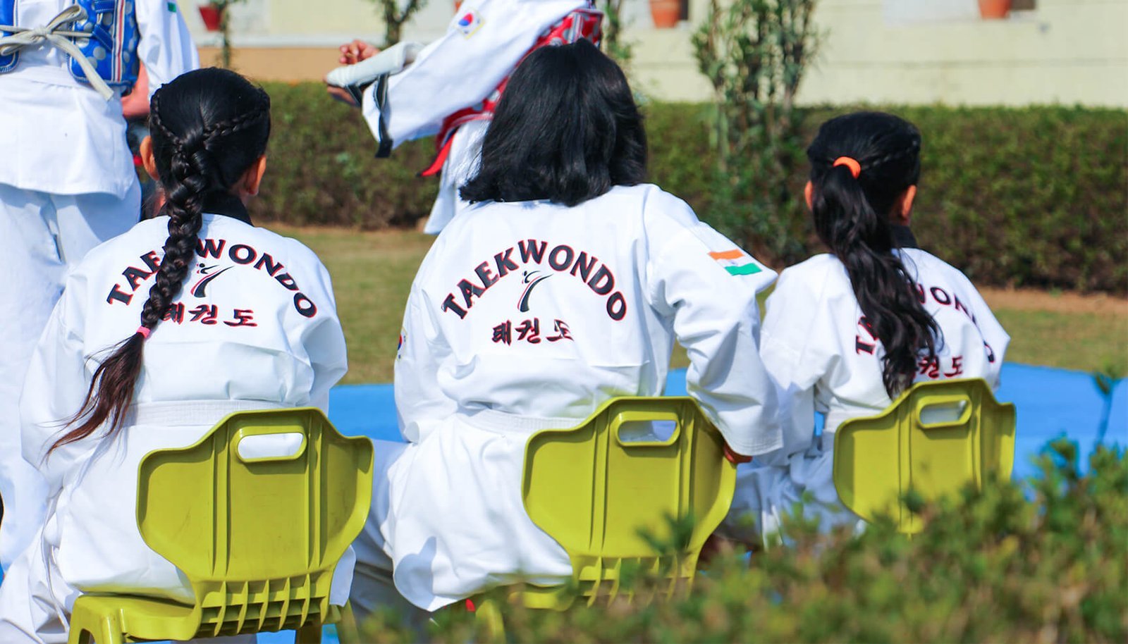 Taekwondo students in white uniforms during training